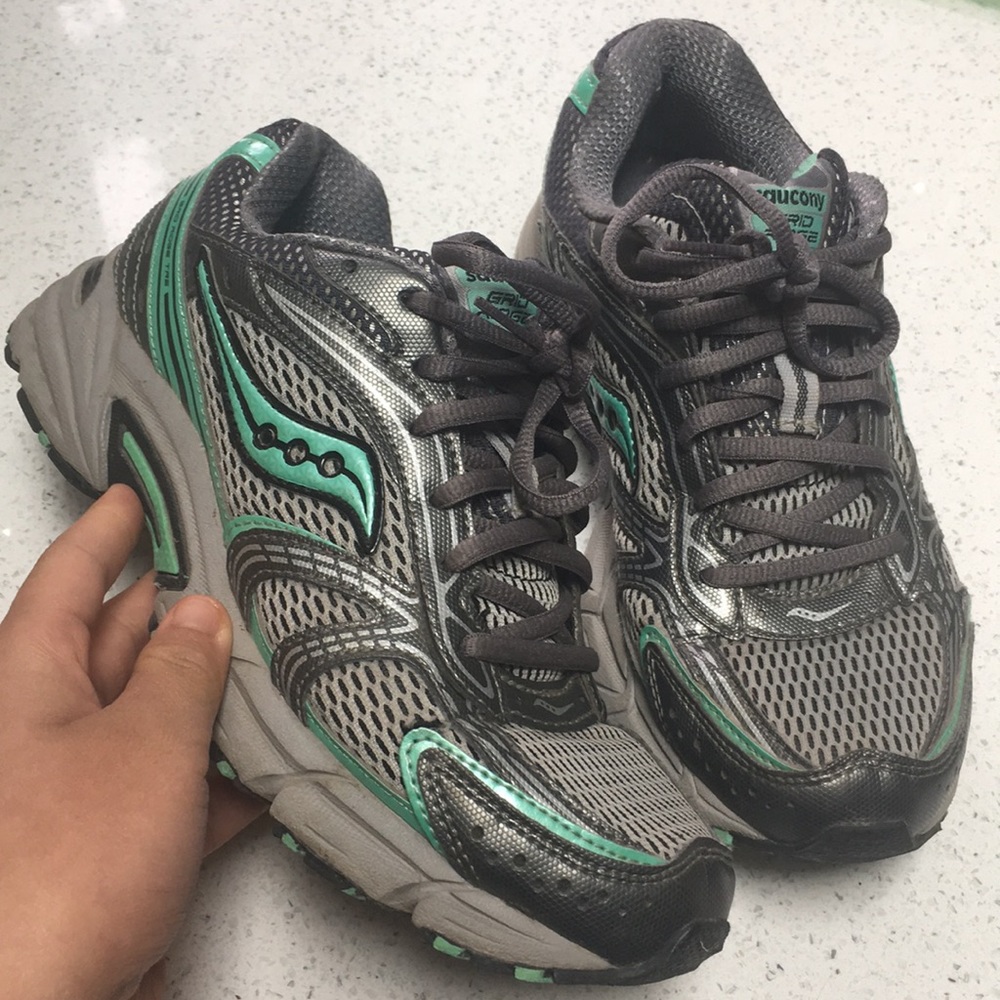 teal & grey pair of saucony running shoes size 6.5